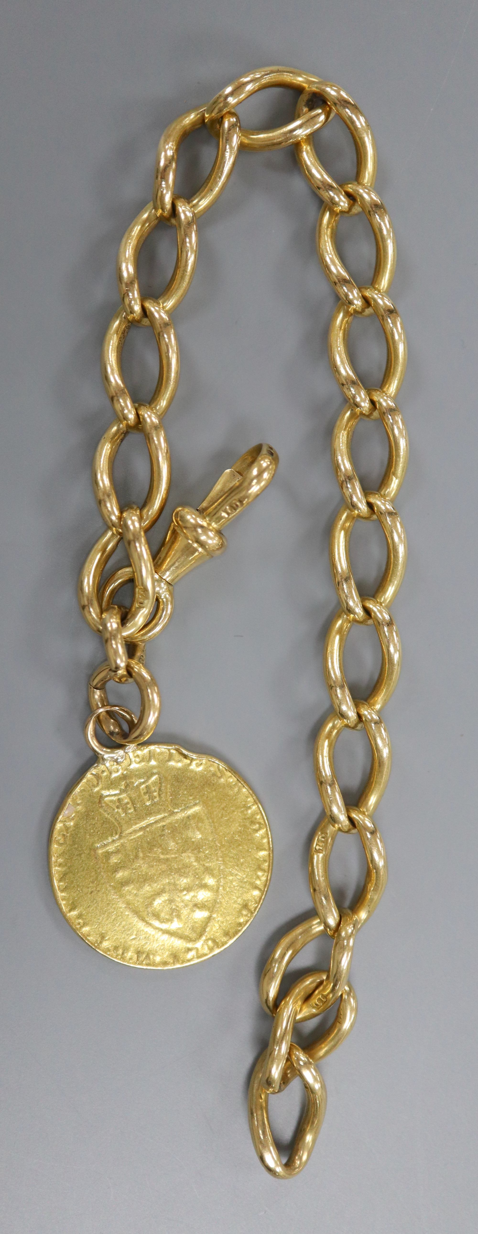 An 18ct gold curb link bracelet hung with a mounted spade guinea, bracelet 21.5cm,